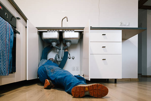 Professional Drain Cleaning technician working in Hampstead, NC